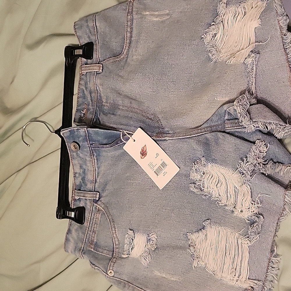 Chelsea and violet  distressed Jean shorts. Size 29